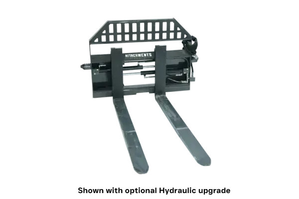 A metal forklift attachment with two long forks extending forward and a grated metal backrest, designed for lifting and moving heavy loads.